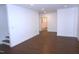 Spacious living room with modern recessed lighting and sleek hardwood flooring at 464 Longfellow St, Fuquay Varina, NC 27526
