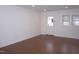 Bright and airy living room featuring hardwood floors and natural light at 464 Longfellow St, Fuquay Varina, NC 27526