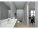 Bathroom featuring a single vanity, a shower with a patterned curtain, and neutral color scheme at 4905 Briarstone Ct, Raleigh, NC 27610