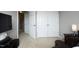 Bedroom featuring double closets, neutral walls, and an open doorway to the hall at 4905 Briarstone Ct, Raleigh, NC 27610