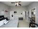 Spacious bedroom with gray walls, an open ensuite bathroom, and a comfortable bed at 4905 Briarstone Ct, Raleigh, NC 27610