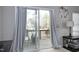Bright living room with sliding door access to deck, neutral tones, ceiling fan, and comfortable furniture at 4905 Briarstone Ct, Raleigh, NC 27610