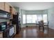 Spacious kitchen with a breakfast nook area next to a large window that allows plenty of natural light at 4905 Briarstone Ct, Raleigh, NC 27610