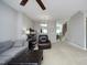 Spacious living room with neutral walls and a cozy seating area, with access to other rooms at 4905 Briarstone Ct, Raleigh, NC 27610