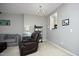 Inviting living room with chandelier and pass-through to kitchen, complete with neutral walls at 4905 Briarstone Ct, Raleigh, NC 27610