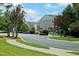 Street view showcases homes with manicured lawns and flowering trees, enhancing curb appeal at 4905 Briarstone Ct, Raleigh, NC 27610