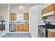 Cozy kitchen with stainless steel appliances and ample cabinetry at 5 Radley Pl, Durham, NC 27705