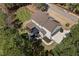 Aerial view showcasing the home's backyard, deck, and exterior features, including landscaping at 5600 Abbey Grace Ln, Wake Forest, NC 27587