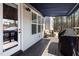 Inviting back deck with an awning, comfortable seating, and outdoor grill, ideal for relaxation and entertainment at 5600 Abbey Grace Ln, Wake Forest, NC 27587