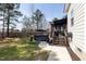 Landscaped backyard with a hot tub, outdoor seating, and well-maintained lawn perfect for entertaining at 5600 Abbey Grace Ln, Wake Forest, NC 27587