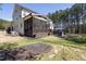 Beautiful backyard showcasing a screened porch, hot tub, and lush landscaping for ultimate outdoor enjoyment at 5600 Abbey Grace Ln, Wake Forest, NC 27587