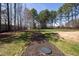 Expansive backyard featuring a walkway and mature trees, perfect for outdoor activities and relaxation at 5600 Abbey Grace Ln, Wake Forest, NC 27587