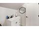 Cozy bathroom features a modern vanity, geometric mirror, and ample natural light at 5600 Abbey Grace Ln, Wake Forest, NC 27587
