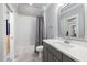 Bathroom featuring a shower-tub combo, white subway tiles, gray vanity, and tile floors at 5600 Abbey Grace Ln, Wake Forest, NC 27587