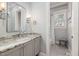 Well lit bathroom with granite countertops, tile floor, and window view in the tub at 5600 Abbey Grace Ln, Wake Forest, NC 27587