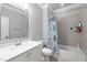 Bathroom featuring subway tile and shower combination with modern fixtures at 5600 Abbey Grace Ln, Wake Forest, NC 27587