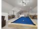 Expansive bonus room with a pool table, bar area, game table, and cozy seating at 5600 Abbey Grace Ln, Wake Forest, NC 27587