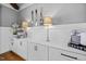 This coffee bar features a Keurig coffee maker, a built-in ice maker and decorative fork, knife and spoon at 5600 Abbey Grace Ln, Wake Forest, NC 27587
