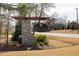 Elegant stone entrance sign for Williams Walk community, surrounded by landscaping and mature trees at 5600 Abbey Grace Ln, Wake Forest, NC 27587