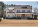 Charming two-story home featuring a welcoming front porch, neatly manicured landscaping, and a classic design at 5600 Abbey Grace Ln, Wake Forest, NC 27587
