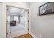 Hallway leading to living room with a leather recliner in the distance at 5600 Abbey Grace Ln, Wake Forest, NC 27587