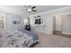 Primary bedroom features carpeted floors, and a wall-mounted TV at 5600 Abbey Grace Ln, Wake Forest, NC 27587