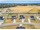 An aerial view features expansive properties near open fields and paved roads at 59 N Clearbrook Ct, Angier, NC 27501