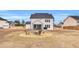 Inviting backyard with a fire pit surrounded by chairs, perfect for outdoor relaxation and entertaining at 59 N Clearbrook Ct, Angier, NC 27501