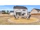 Backyard features a circular firepit area with seating and patio at 59 N Clearbrook Ct, Angier, NC 27501