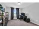 Bedroom with neutral tones, a large window, and carpeted floors create a calm and inviting atmosphere at 59 N Clearbrook Ct, Angier, NC 27501