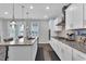 Well-equipped kitchen with granite countertops, a gas cooktop, and stylish pendant lighting offers practical elegance at 59 N Clearbrook Ct, Angier, NC 27501
