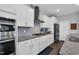 Contemporary kitchen with white cabinetry, granite countertops, and stainless steel appliances at 59 N Clearbrook Ct, Angier, NC 27501