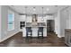 Modern kitchen with stainless steel appliances, a granite island, and pendant lighting for style and functionality at 59 N Clearbrook Ct, Angier, NC 27501