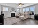 Bright living room with a fireplace, large windows, and modern decor provides a cozy atmosphere at 59 N Clearbrook Ct, Angier, NC 27501
