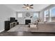 Comfortable living room with a fireplace, a ceiling fan, and modern furnishings offers a relaxed space at 59 N Clearbrook Ct, Angier, NC 27501
