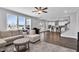 Open-concept living room leads to a kitchen with an island and breakfast bar, perfect for modern living at 59 N Clearbrook Ct, Angier, NC 27501