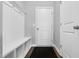 Mud room with a built-in bench, storage cubbies, and hooks, perfect for organizing entryway essentials at 59 N Clearbrook Ct, Angier, NC 27501
