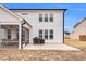 Back of the home showcasing the patio and white vinyl siding at 59 N Clearbrook Ct, Angier, NC 27501