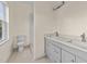 Bathroom featuring a double sink vanity, modern fixtures, and a view of the shower at 612 Lakeview Dr, Raleigh, NC 27603