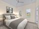A cozy bedroom with neutral tones, plush carpet, and bright natural light at 612 Lakeview Dr, Raleigh, NC 27603