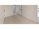 An empty bedroom with light wood floors and neutral paint provides a blank canvas at 612 Lakeview Dr, Raleigh, NC 27603