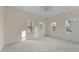 Light-filled bedroom featuring three windows and a ceiling fan at 612 Lakeview Dr, Raleigh, NC 27603