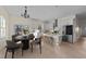 Modern kitchen with an island, stainless steel appliances, and adjacent dining space for easy entertaining at 612 Lakeview Dr, Raleigh, NC 27603