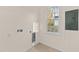 A laundry room with connections, a window, and an electrical panel at 612 Lakeview Dr, Raleigh, NC 27603