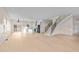 Bright and airy space with hardwood floors, modern kitchen, and a staircase, all bathed in natural light at 612 Lakeview Dr, Raleigh, NC 27603