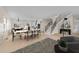 Open-concept space with dining area, modern kitchen, and staircase, perfect for entertaining and Gathering life at 612 Lakeview Dr, Raleigh, NC 27603