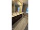 Bathroom with double sink vanity, tile floor and shower at 621 Rockcastle Dr, Cary, NC 27519