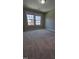 Bedroom with windows, neutral carpet and natural light at 621 Rockcastle Dr, Cary, NC 27519