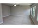 Spacious bedroom with neutral walls, plush carpeting, and a modern ceiling fan fixture at 621 Rockcastle Dr, Cary, NC 27519