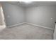 Carpeted bedroom with neutral walls and ceiling light at 621 Rockcastle Dr, Cary, NC 27519